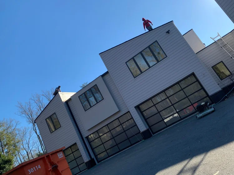Completed residential roofing and siding project by CS1 Construction.