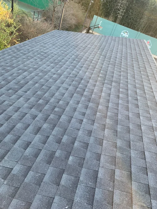 Finished exterior of a residential roofing and siding job by CS1 Construction.